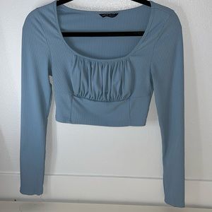 Blue long sleeve with stretched ripped